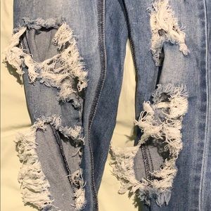Shredded ripped jeans